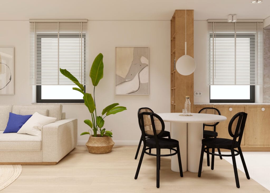 Elegancka jadalnia w otwartej przestrzeni z okrągłym stołem i roślinnością