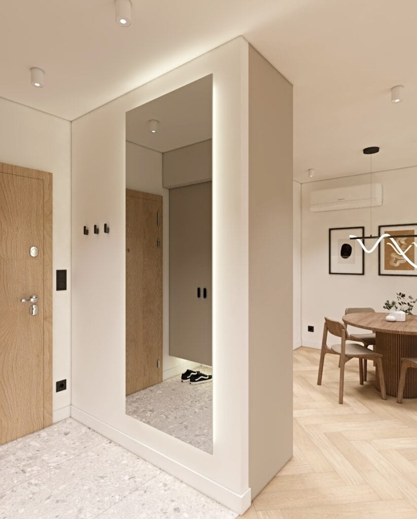 Elegancki korytarz z dużym lustrem podświetlanym