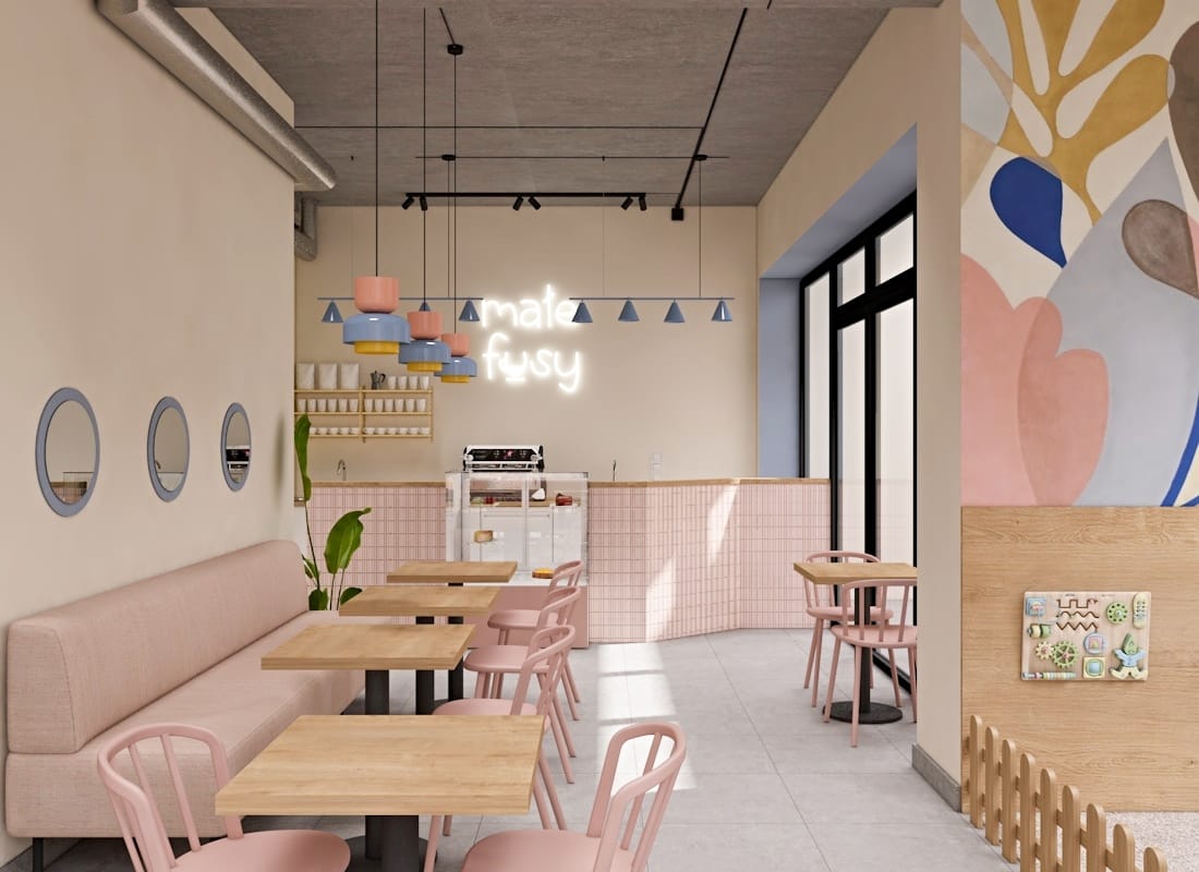 Kawiarnia Małe Fusy w Poznaniu, w pastelowych odcieniach różu i niebieskości z drewnianymi akcentami.