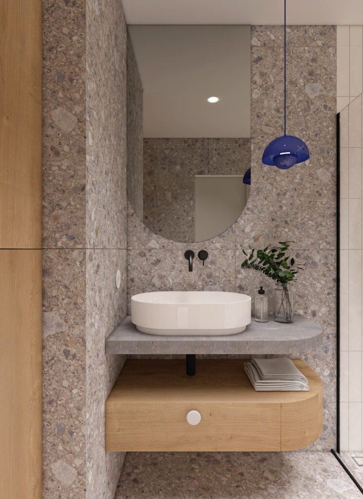 Nowoczesna łazienka w stylu minimalistycznym z umywalką nablatową i okrągłym lustrem