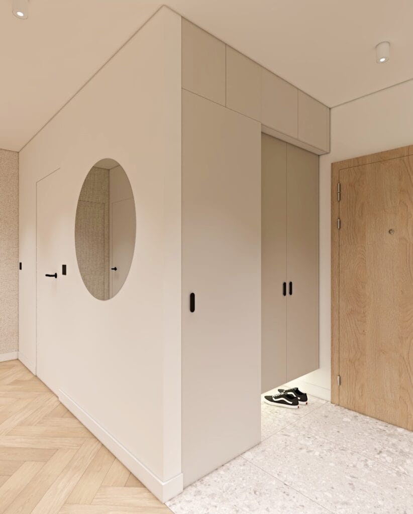 Nowoczesny przedpokój w stylu japandi z okrągłym lustrem i zabudowaną szafą