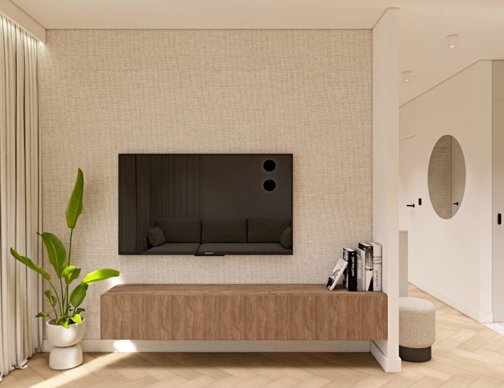 Nowoczesny salon w stylu minimalistycznym z telewizorem na ścianie i drewnianą szafką