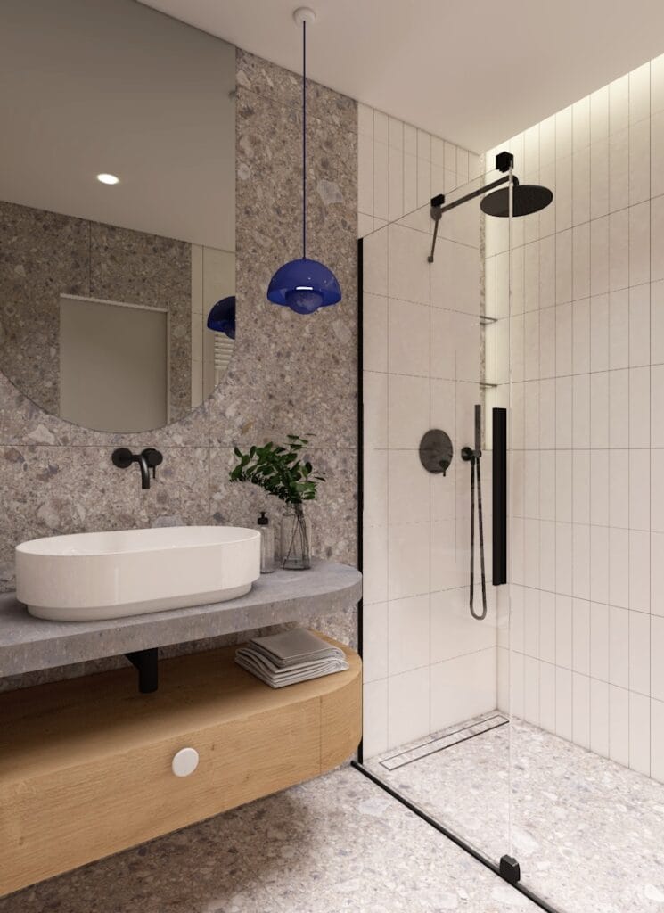 Stylowa łazienka z betonowym blatem i drewnianą szafką